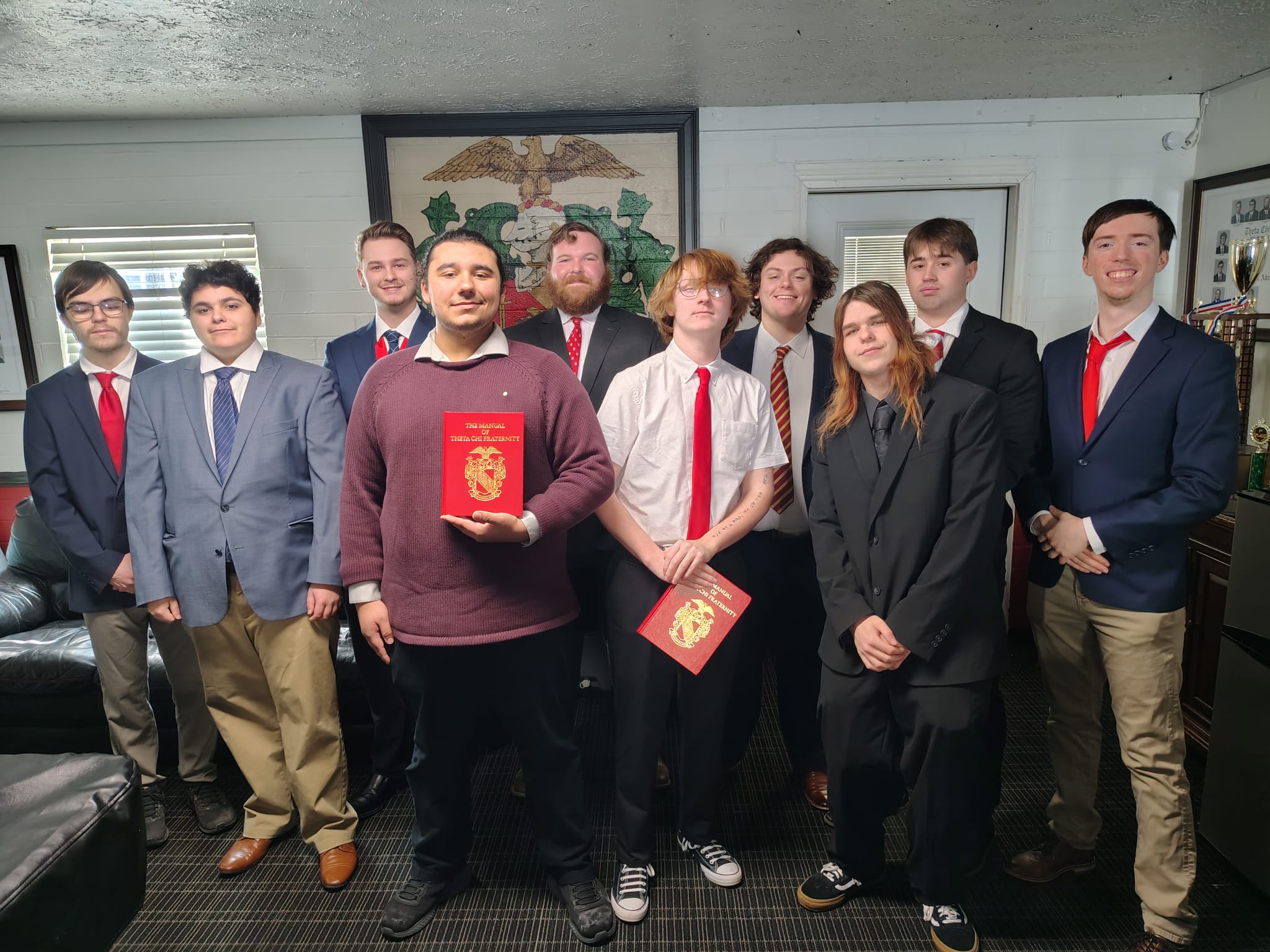 New members with Theta Chi manuals